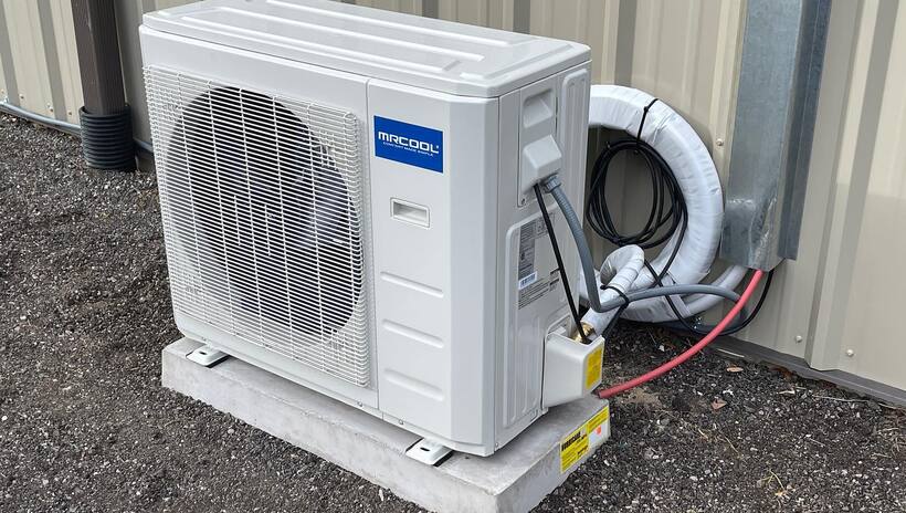 HVAC technician from Evanx Cooling Systems at work